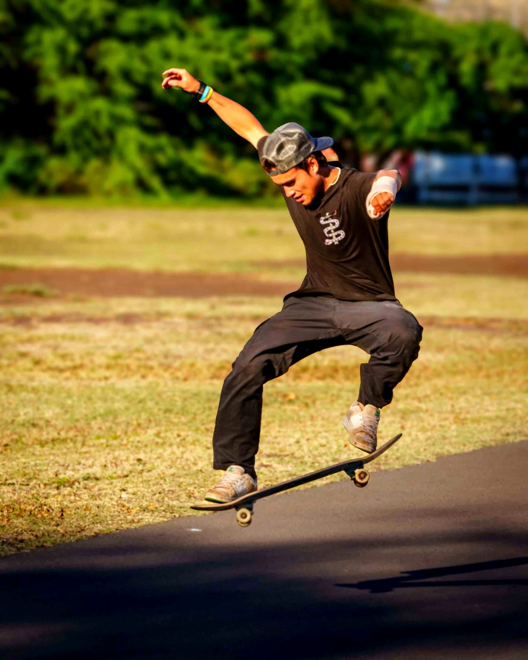 A young skateboarder in mid-air